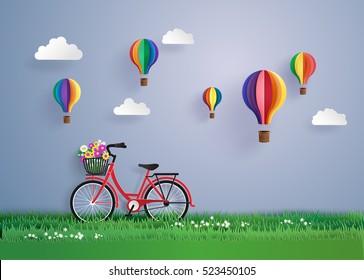 Bicycle in the garden with colorful hot air balloon . digital craft and paper art style.