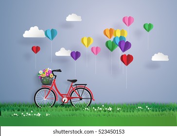 Bicycle in the garden with colorful hot air balloon heart sharp. paper art  and  digital craft style.