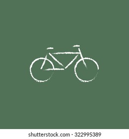 Bicycle hand drawn in chalk on a blackboard vector white icon isolated on a green background.