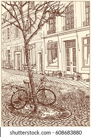 Bicycle near a tree on the street of the old town in Europe. Black and white dashed style sketch, line art, drawing with pen and ink. Retro vintage picture.
