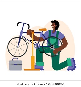 Bicycle repair. A black man repairs a bicycle. The mechanic repairs the bicycle, the mechanic inflates the wheels. Web graphics, banners, advertisements, business templates. 