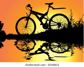 bicycle rest in sunset near water