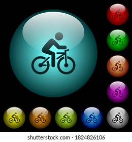 Bicycle with rider icons in color illuminated spherical glass buttons on black background. Can be used to black or dark templates