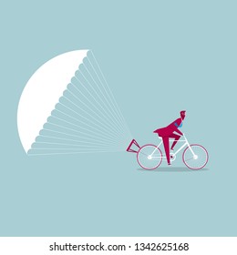 The bicycle is slowed down using a parachute. Isolated on blue background.