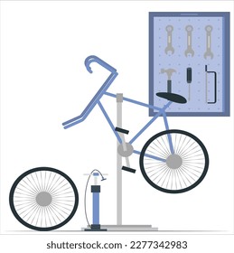 Bicycle tools in the board. Bike mechanic garage with workshop tools wall. Repair concept. Mountain bicycle during the repairing process hanging on the stand at the workshop