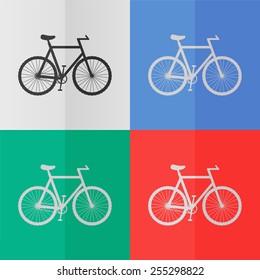 Bicycle vector icon. Effect of folded paper. Colored (red, blue, green) illustrations. Flat design