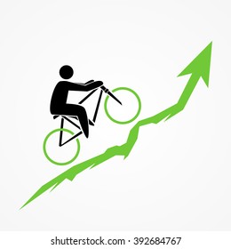 Bicyclist rides over green arrow