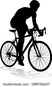 Bicyclist riding their bike and wearing a safety helmet in silhouette