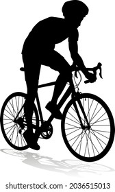 Bicyclist riding their bike and wearing a safety helmet in silhouette