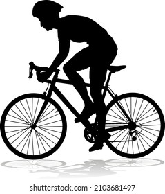 Bicyclist riding their bike and wearing a safety helmet in silhouette