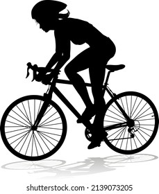 Bicyclist riding their bike and wearing a safety helmet in silhouette