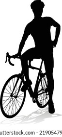 Bicyclist riding their bike and wearing a safety helmet in silhouette