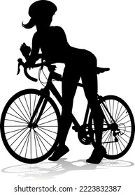 Bicyclist riding their bike and wearing a safety helmet in silhouette