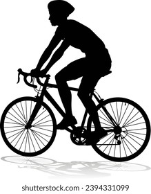 Bicyclist riding their bike and wearing a safety helmet in silhouette