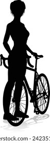 Bicyclist riding their bike and wearing a safety helmet in silhouette