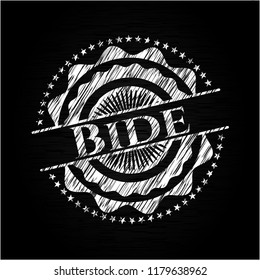Bide written on a chalkboard