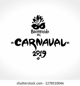 Bienvenido al Carnaval. 2019. Beautiful black logo in spanish. Translated as Welcome to Carnival. Vector handwritten logo with mask. Painted mask and inscription original graphic pattern imitation of 