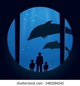 Big Aquarium or Dolphinarium With dolphin. People with children watching the underwater world