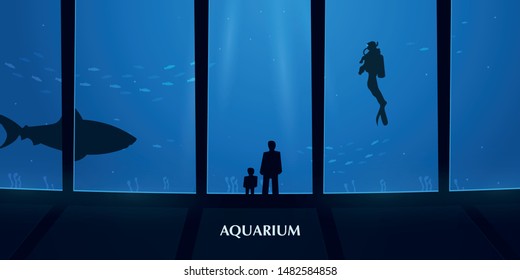 Big Aquarium or Oceanarium With shark. People watching the underwater world