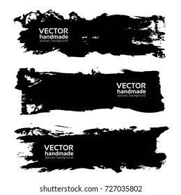 Big black long brush strokes isolated on a white background
