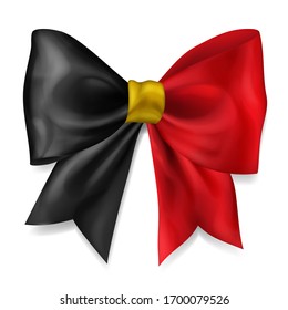 Big bow made of ribbon in Belgium flag colors with shadow on white background
