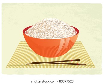 The big bowl with rice and chopsticks on a bamboo rug