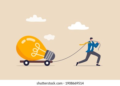 Big business idea, innovation or inspiration to start new business, effort or inspiration for creativity ideas concept, ambitious businessman work hard to pulling big light bulb idea.