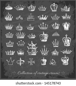 Big collection of vintage crowns in sketchy style on blackboard. Vector illustration.