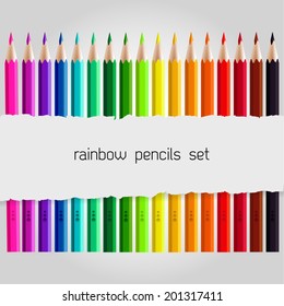 Big colored pencil set with piece of torn paper over