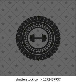big dumbbell icon inside black badge