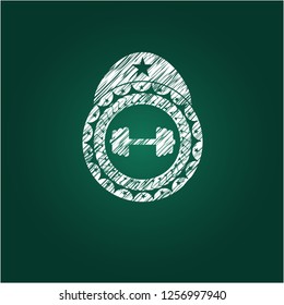 big dumbbell icon inside chalkboard emblem on black board