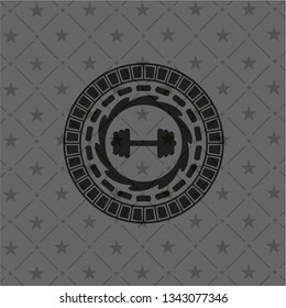big dumbbell icon inside dark badge or emblem