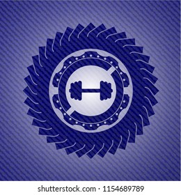 big dumbbell icon inside denim background