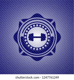 big dumbbell icon inside denim background