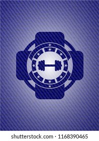 big dumbbell icon inside emblem with jean texture