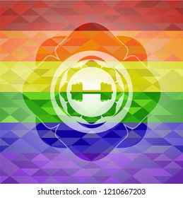 big dumbbell icon inside emblem on mosaic background with the colors of the LGBT flag