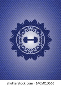 big dumbbell icon inside emblem with denim texture