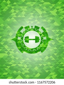 big dumbbell icon inside green mosaic emblem