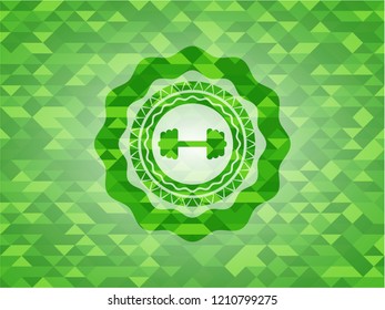 big dumbbell icon inside green mosaic emblem