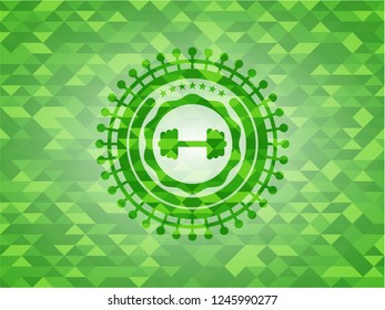 big dumbbell icon inside green emblem with triangle mosaic background