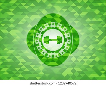 big dumbbell icon inside green emblem with mosaic background