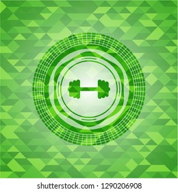 big dumbbell icon inside green mosaic emblem