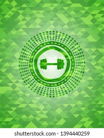 big dumbbell icon inside green emblem. Mosaic background