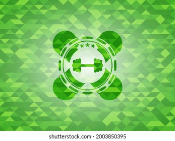gran icono de timbre dentro del emblema del mosaico verde. 