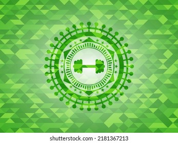 big dumbbell icon inside green mosaic emblem. 