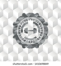 big dumbbell icon inside grey badge with geometric cube white background