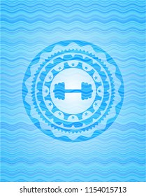 big dumbbell icon inside light blue water wave style emblem.