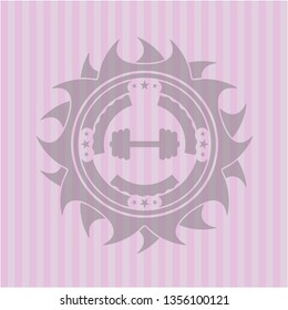 big dumbbell icon inside pink emblem