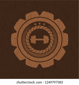 big dumbbell icon inside realistic wooden emblem