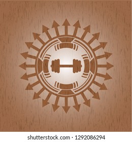 big dumbbell icon inside realistic wood emblem